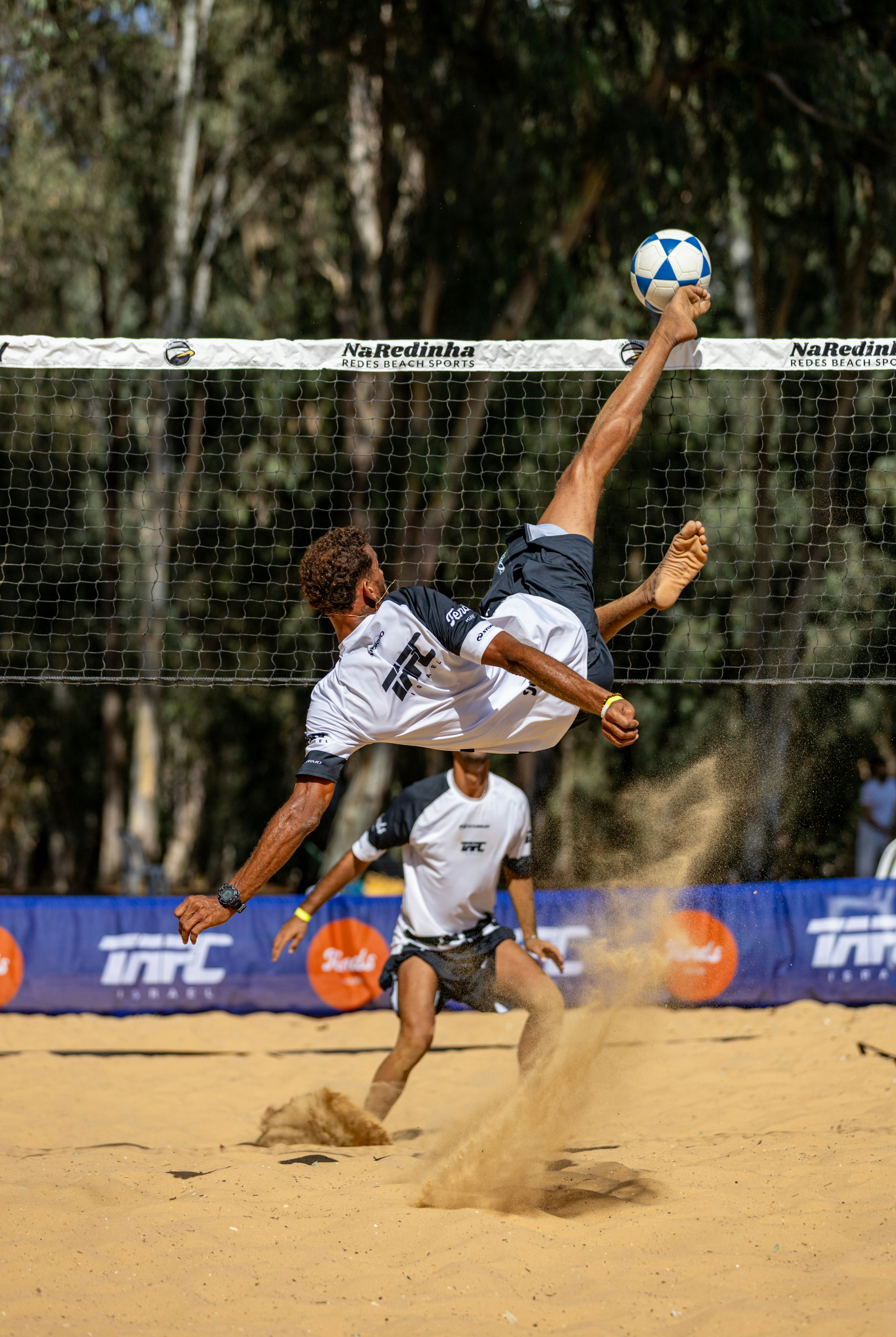 man doing a bicycle kick